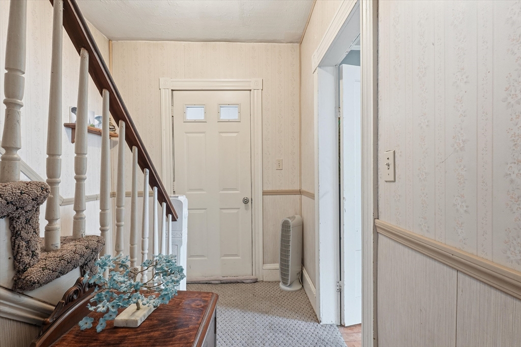 59 Fay Street Lowell, MA 01852 - Photo 15 of 33 a view of entryway with wooden floor and stairs