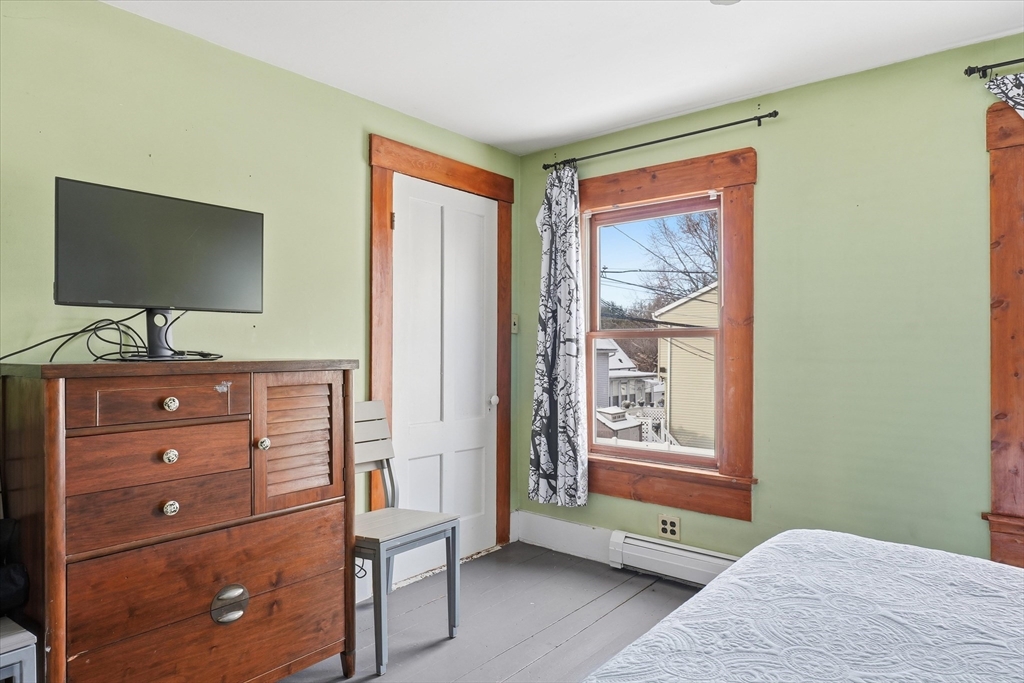 59 Fay Street Lowell, MA 01852 - Photo 21 of 33 a bedroom with a bed and a flat screen tv