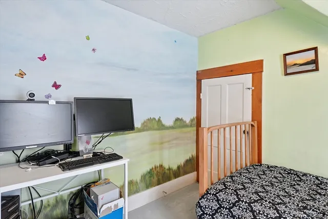 a bedroom with furniture and a window