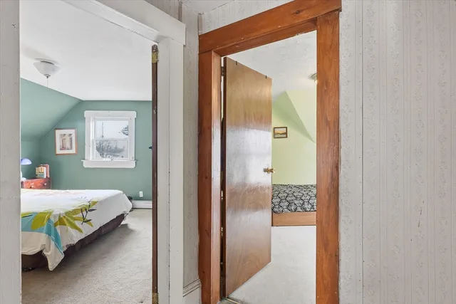 a bedroom with a bed and a table