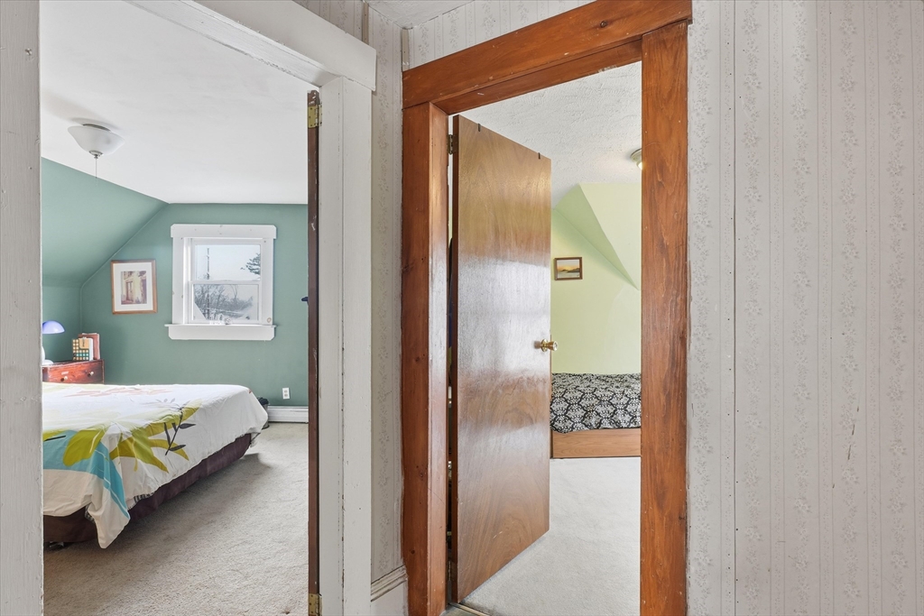 59 Fay Street Lowell, MA 01852 - Photo 24 of 33 a bedroom with a bed and a table