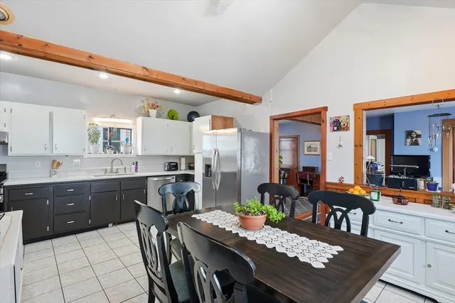 a kitchen with a table and chairs in it