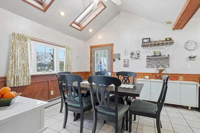a dining room with furniture and window