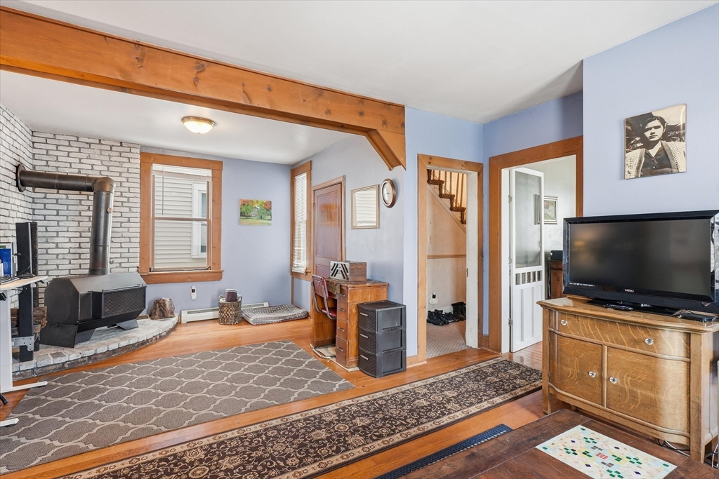 59 Fay Street Lowell, MA 01852 - Photo 9 of 33 a living room with furniture and a flat screen tv