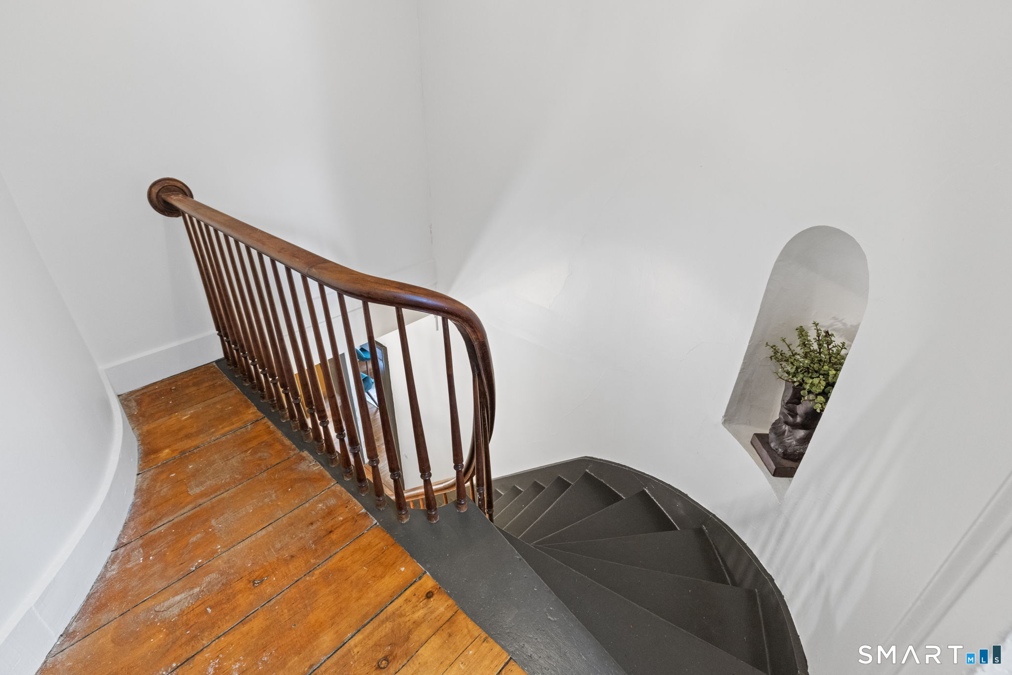 31 Canterbury Road Brooklyn, CT 06234 - Photo 28 of 40 There are two sets of stairs that lead upstairs. This is the main staircase off of the front entrance.