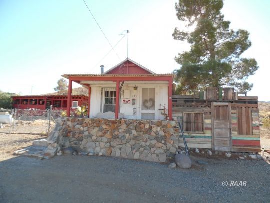133 Butte Avenue Randsburg, CA 93554 - Photo 2 of 9 a front view of a house with a yard