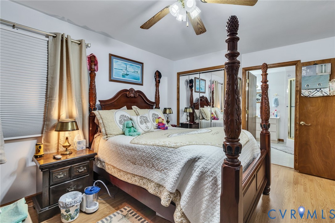 4400 Hacks Neck Road Heathsville, VA 22473 - Photo 37 of 78 a bedroom with a bed and wooden floor