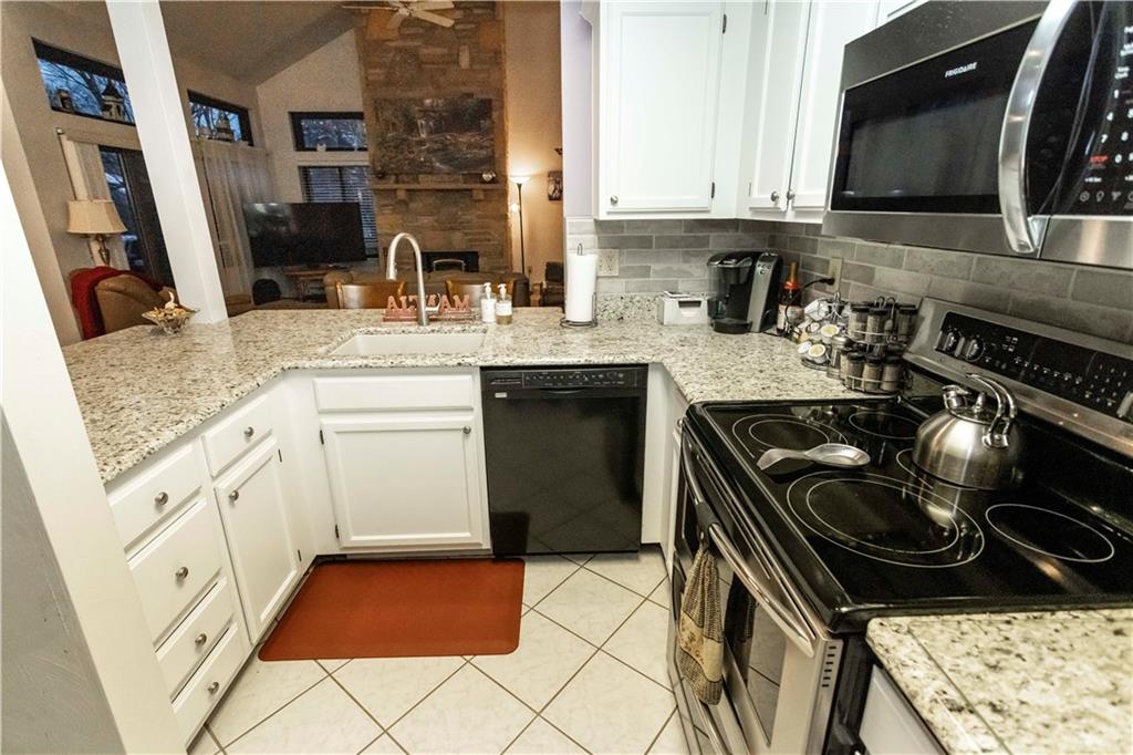 1918 South Ridge Court Hidden Valley, PA 15502 - Photo 14 of 41 a kitchen with a sink stove and cabinets