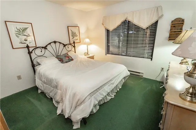 a bathroom with a sink a toilet and shower curtain