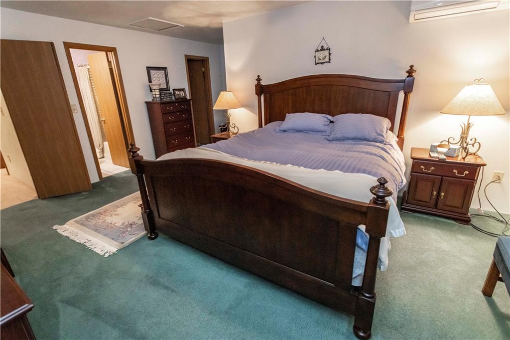 1918 South Ridge Court Hidden Valley, PA 15502 - Photo 25 of 41 a bedroom with a bed and a mirror