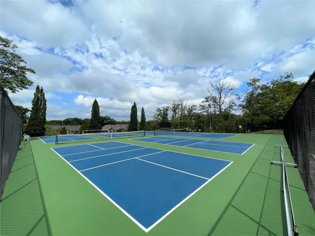 a view of a wooden door with a yard