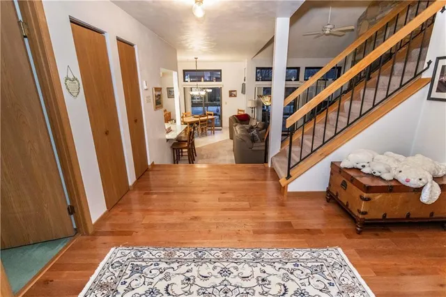 a view of an entryway with wooden floor