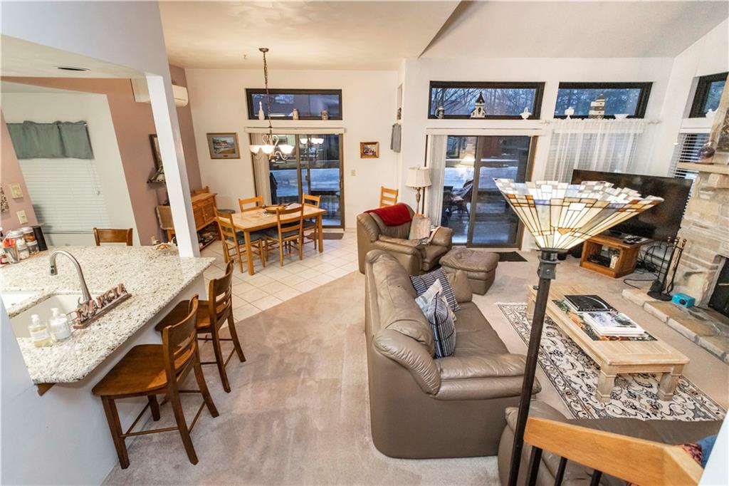 1918 South Ridge Court Hidden Valley, PA 15502 - Photo 8 of 41 a living room with furniture a fireplace and a chandelier