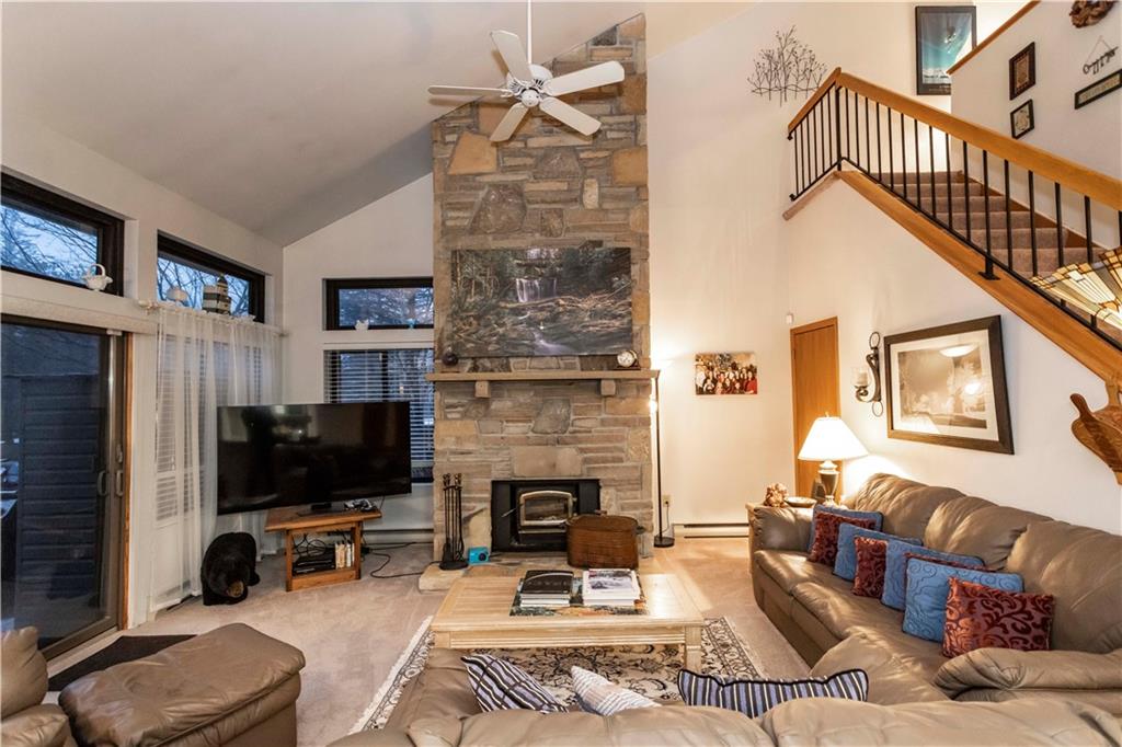 1918 South Ridge Court Hidden Valley, PA 15502 - Photo 9 of 41 a living room with furniture a flat screen tv and a fireplace