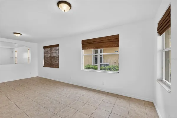 a view of a kitchen with furniture and an empty room
