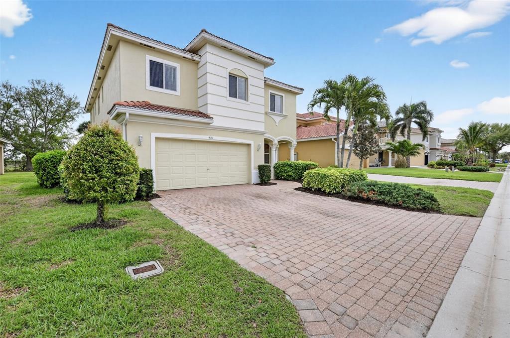 4197 River Bank Way Punta Gorda, FL 33980 - Photo 2 of 73 a front view of a house with garden