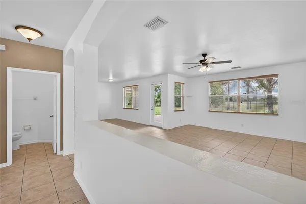 a view of a chandelier fan in a room