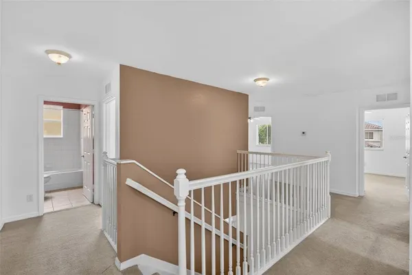 a bathroom with a granite countertop toilet a sink and a mirror