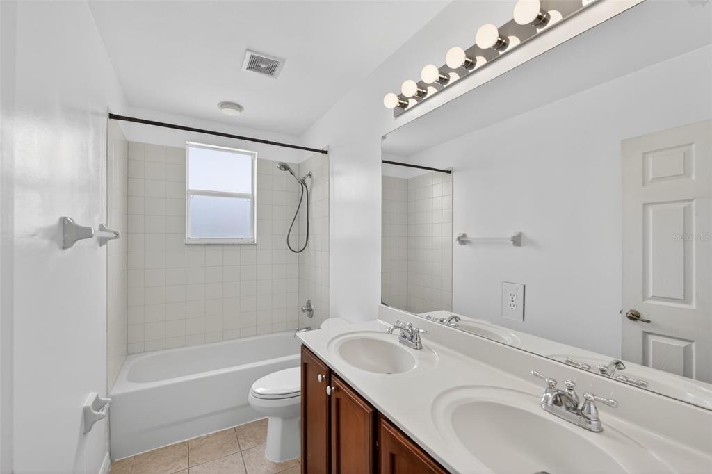 4197 River Bank Way Punta Gorda, FL 33980 - Photo 33 of 73 a bathroom with a sink a toilet and shower