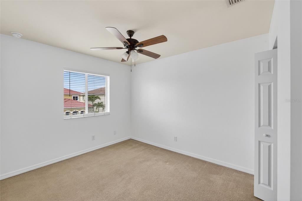 4197 River Bank Way Punta Gorda, FL 33980 - Photo 34 of 73 an empty room with a window and a fan