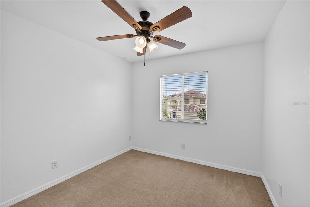 4197 River Bank Way Punta Gorda, FL 33980 - Photo 36 of 73 an empty room with a window and a fan