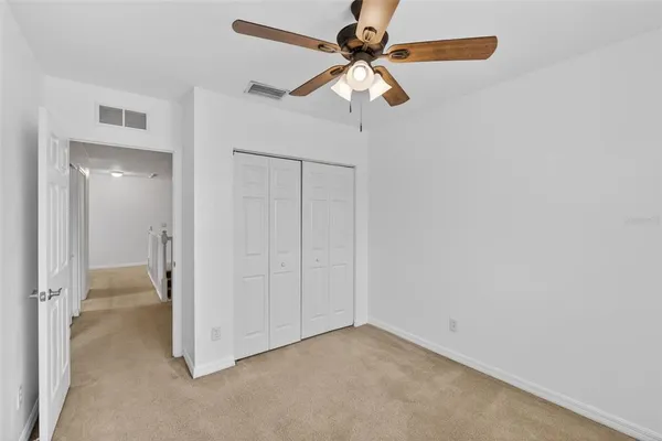 a front view of a house with a garden and yard