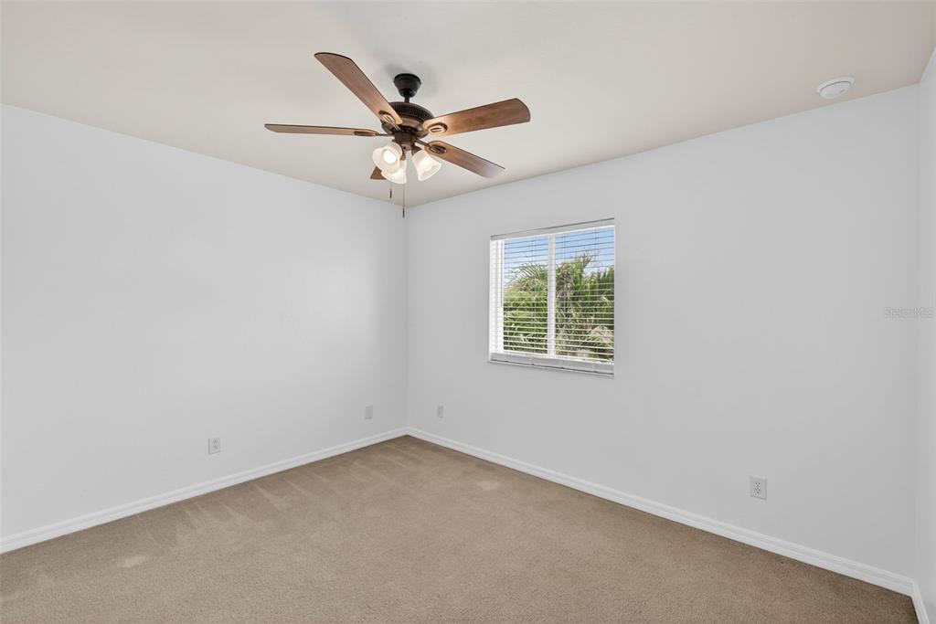 4197 River Bank Way Punta Gorda, FL 33980 - Photo 39 of 73 an empty room with a window and a fan