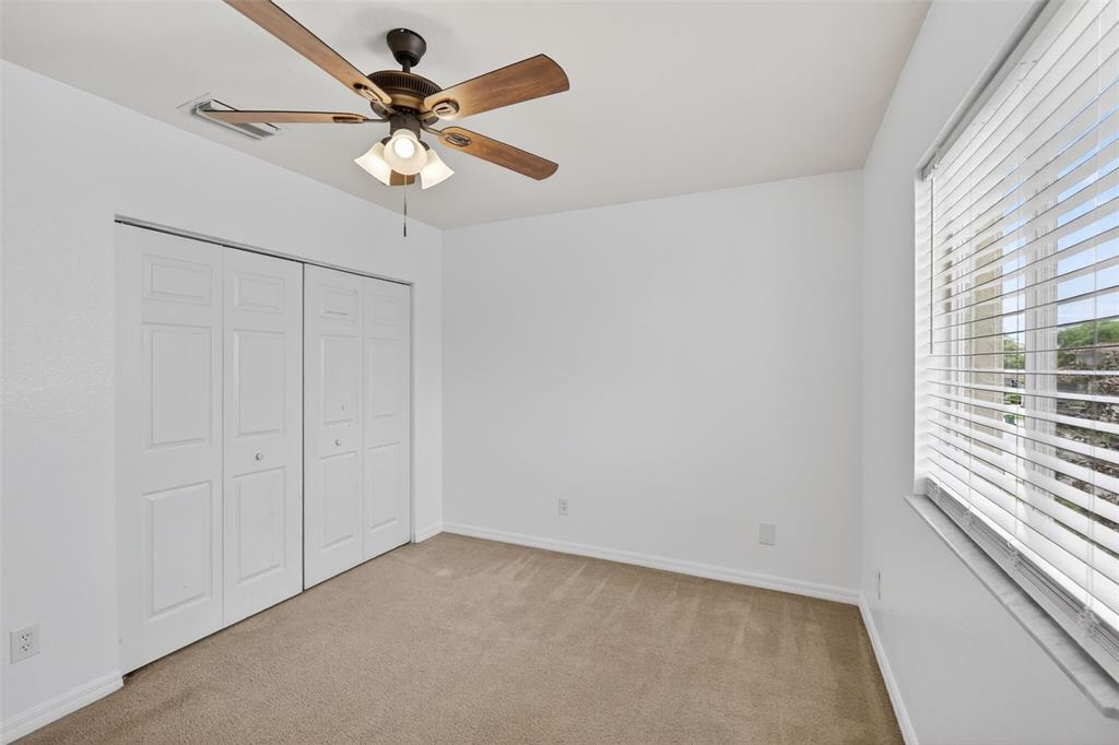 4197 River Bank Way Punta Gorda, FL 33980 - Photo 40 of 73 a view of an empty room with a ceiling fan and window