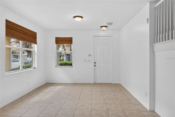 a view of an entryway with wooden floor