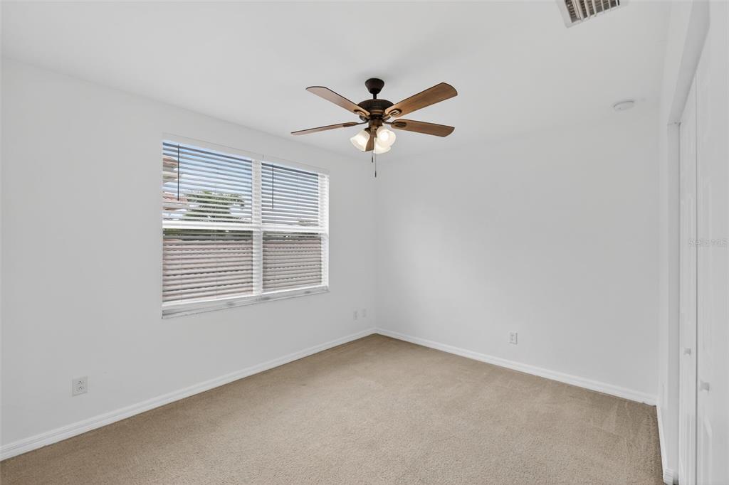 4197 River Bank Way Punta Gorda, FL 33980 - Photo 41 of 73 a view of a livingroom with a ceiling fan and window
