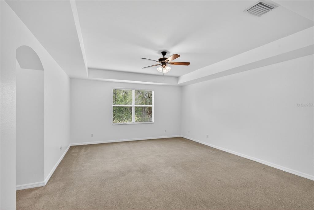 4197 River Bank Way Punta Gorda, FL 33980 - Photo 44 of 73 an empty room with a window and a ceiling fan