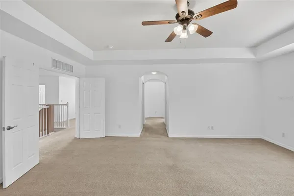 a view of a patio with table and chairs with wooden floor and fence