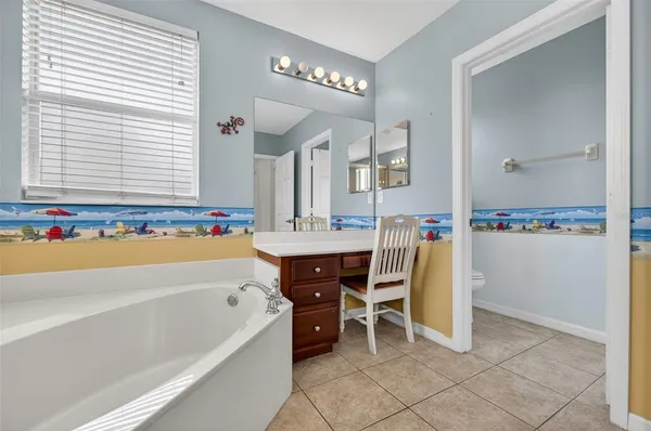 a terrace with outdoor seating and city view