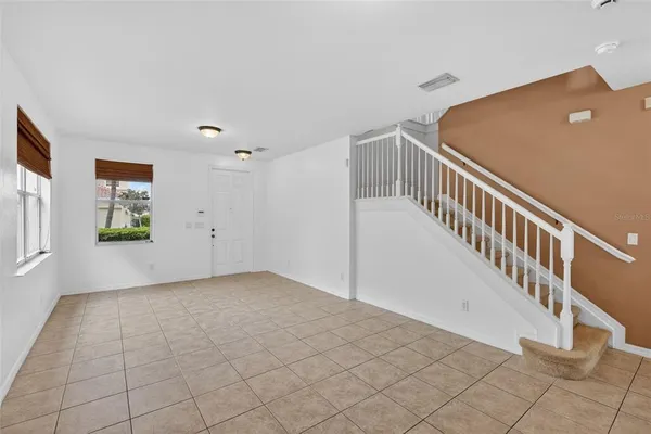 a kitchen with stainless steel appliances granite countertop a sink stove refrigerator and cabinets
