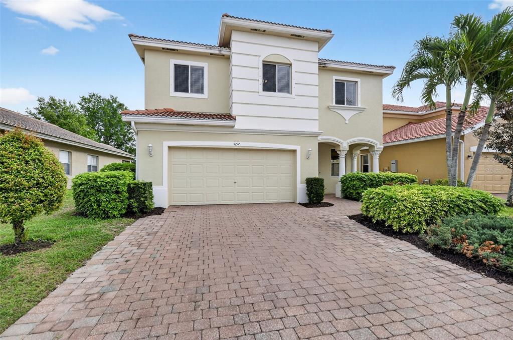 4197 River Bank Way Punta Gorda, FL 33980 - Photo 53 of 73 a front view of a house with a yard and garage