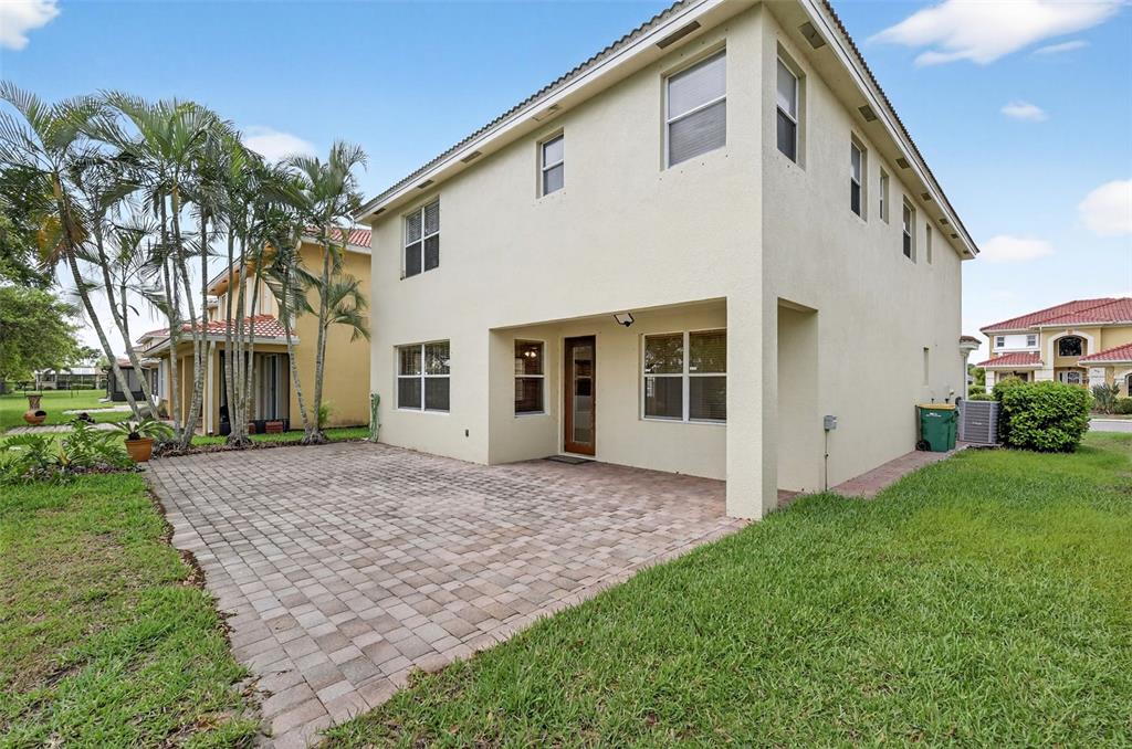 4197 River Bank Way Punta Gorda, FL 33980 - Photo 55 of 73 a front view of a house with a garden and yard