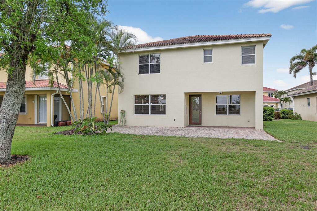 4197 River Bank Way Punta Gorda, FL 33980 - Photo 57 of 73 a front view of a house with a yard and trees