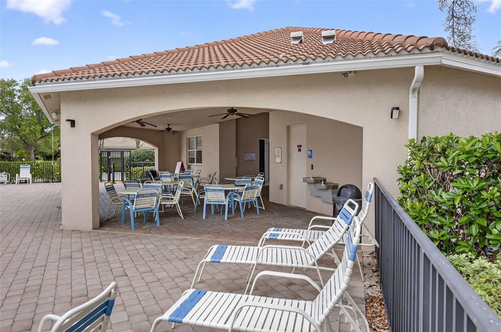 4197 River Bank Way Punta Gorda, FL 33980 - Photo 68 of 73 a view of a patio with table and chairs with wooden floor and fence