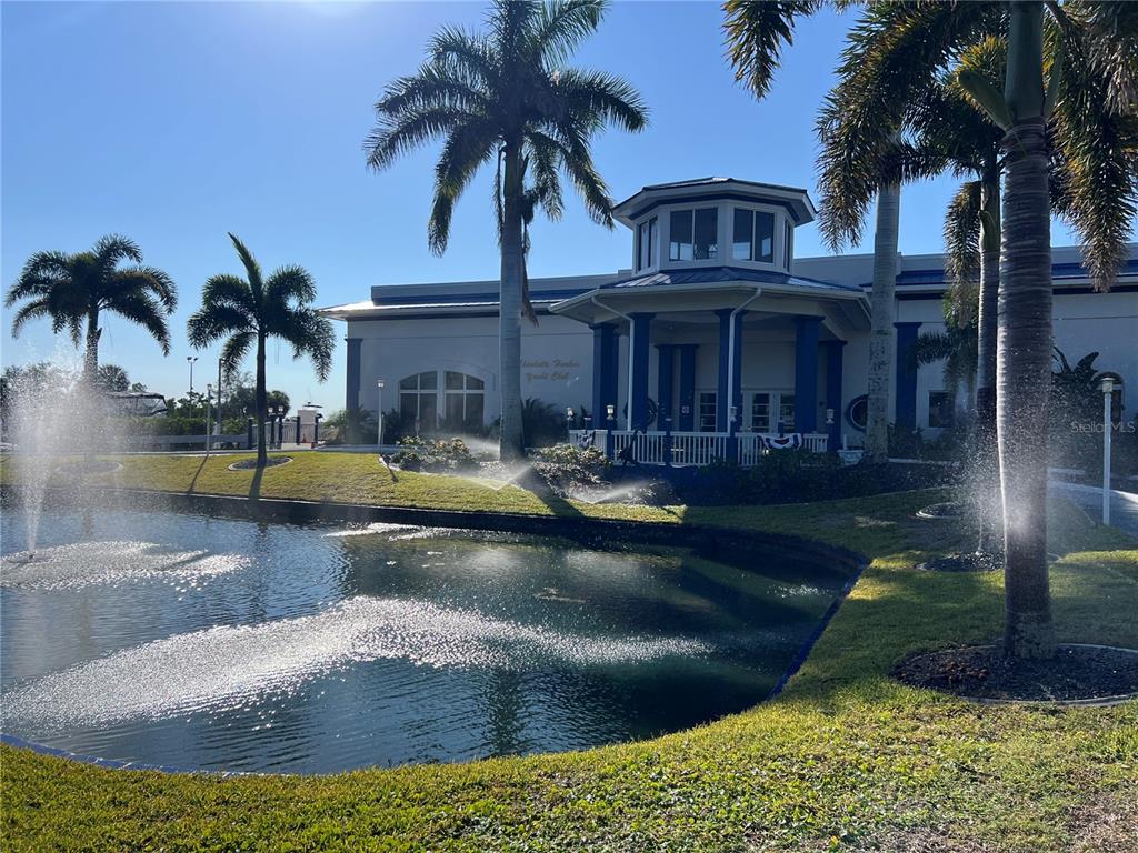 4197 River Bank Way Punta Gorda, FL 33980 - Photo 70 of 73 a view of a house with swimming pool and a yard