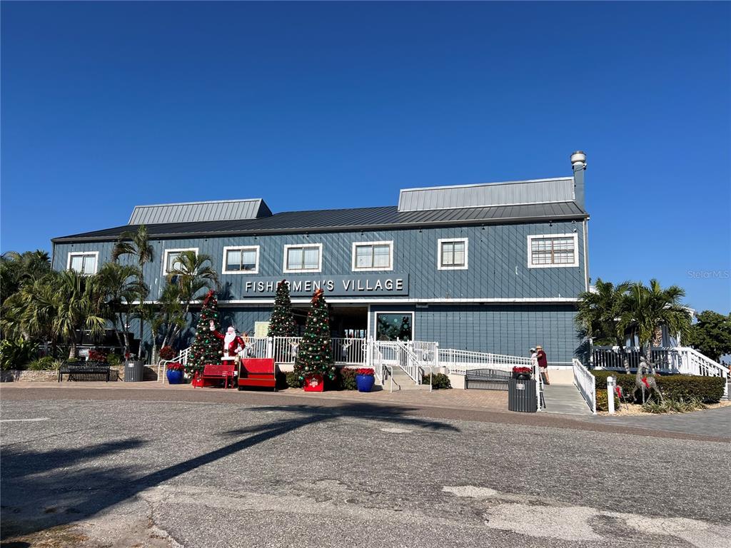 4197 River Bank Way Punta Gorda, FL 33980 - Photo 72 of 73 a front view of a building with street