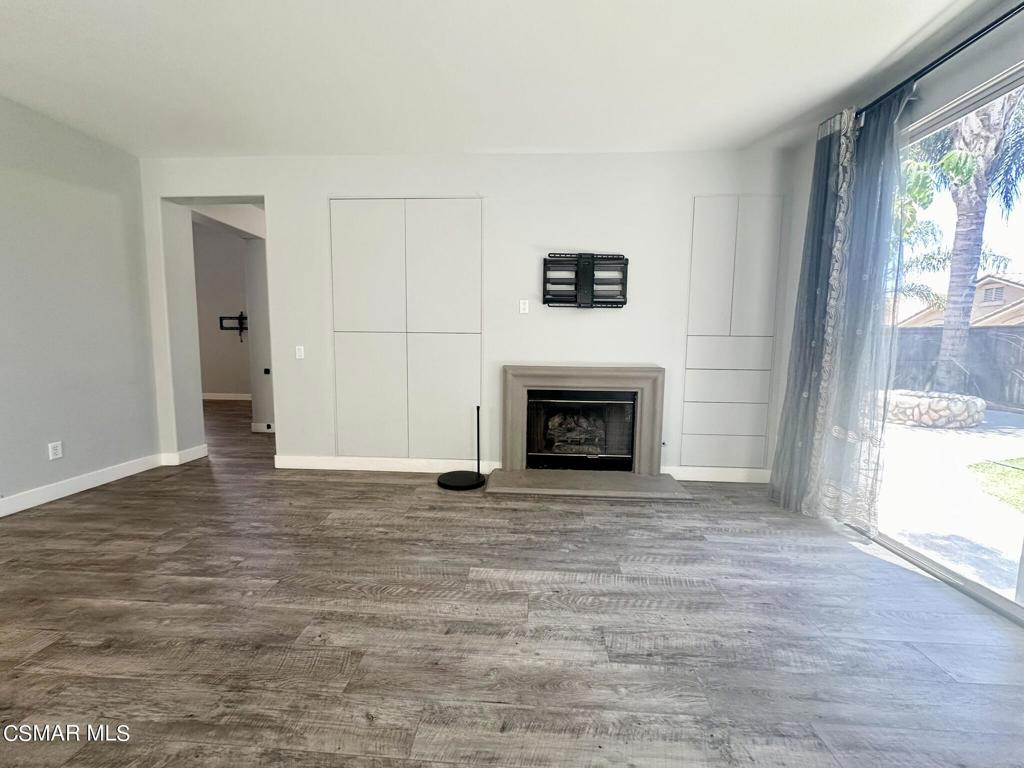 111 Macademia Lane Simi Valley, CA 93065 - Photo 11 of 38 a view of an empty room with a window and a fireplace