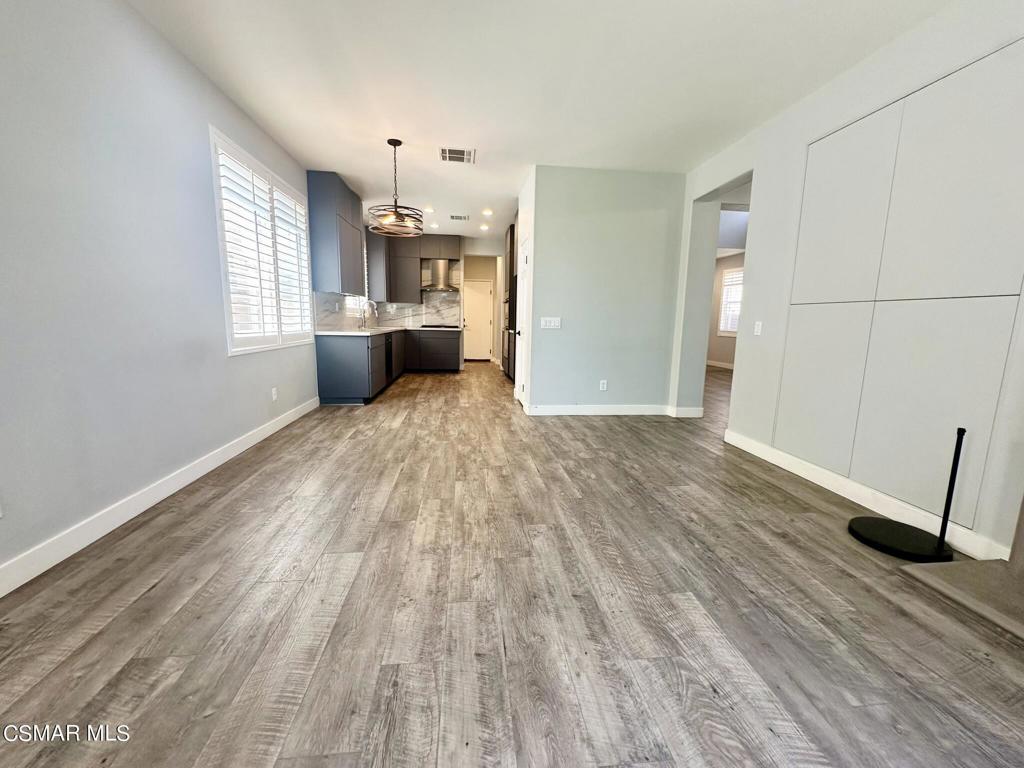 111 Macademia Lane Simi Valley, CA 93065 - Photo 12 of 38 a view of a kitchen with furniture and wooden floor