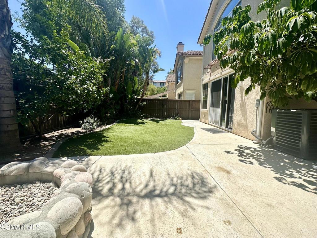 111 Macademia Lane Simi Valley, CA 93065 - Photo 16 of 38 a view of a house with a yard and pathway