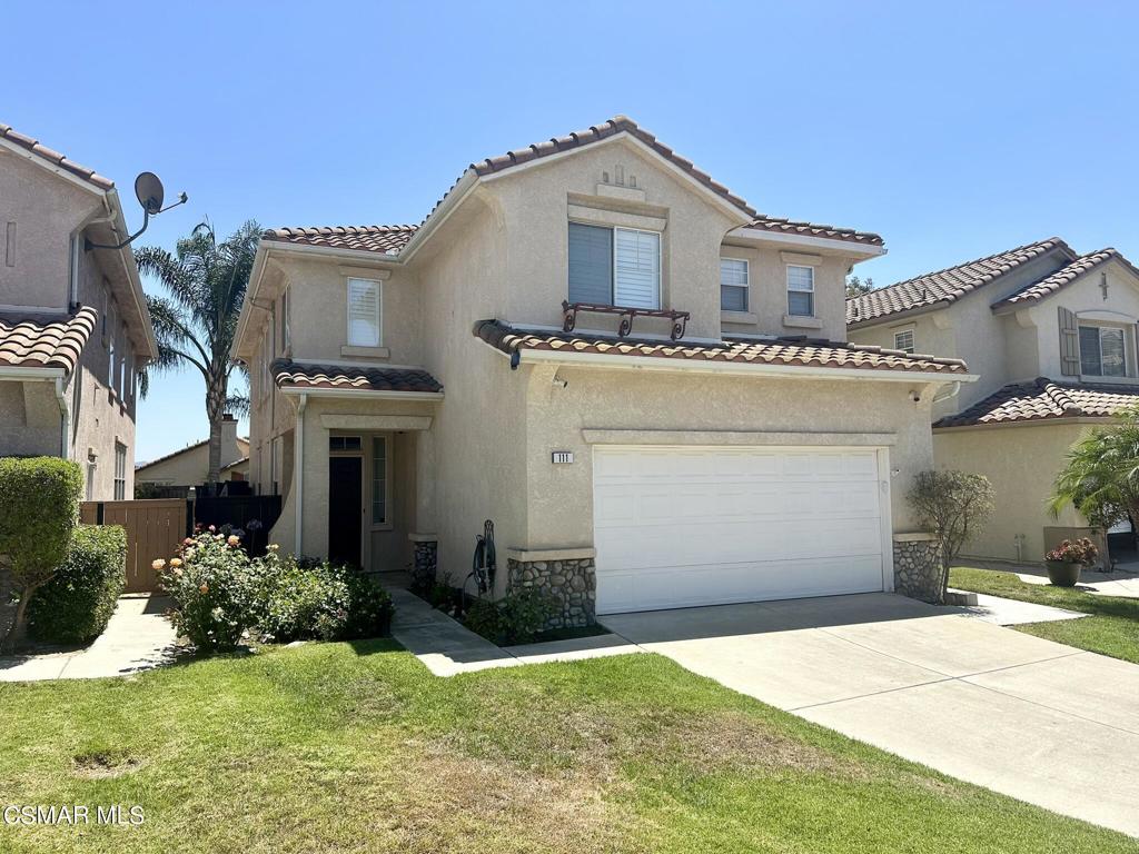 111 Macademia Lane Simi Valley, CA 93065 - Photo 2 of 38 a front view of a house with a yard and garage