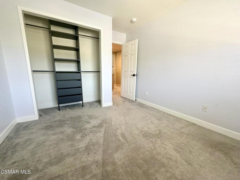 111 Macademia Lane Simi Valley, CA 93065 - Photo 29 of 38 an empty room with a cabinet and mirrors