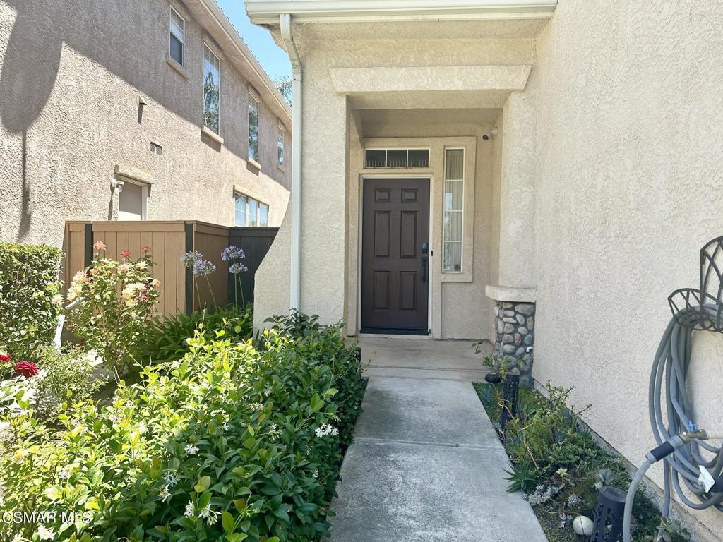 111 Macademia Lane Simi Valley, CA 93065 - Photo 3 of 38 a front view of a house with a yard