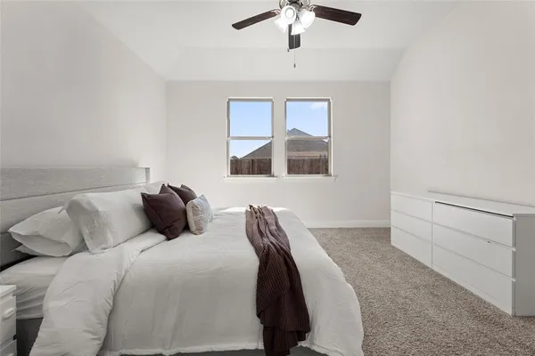 a bed room with a bed and a chandelier