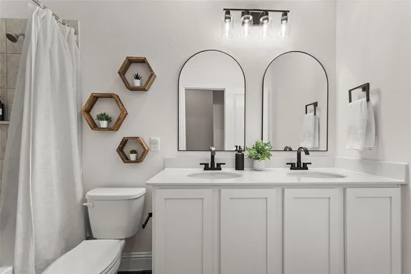 a bathroom with a toilet and a sink