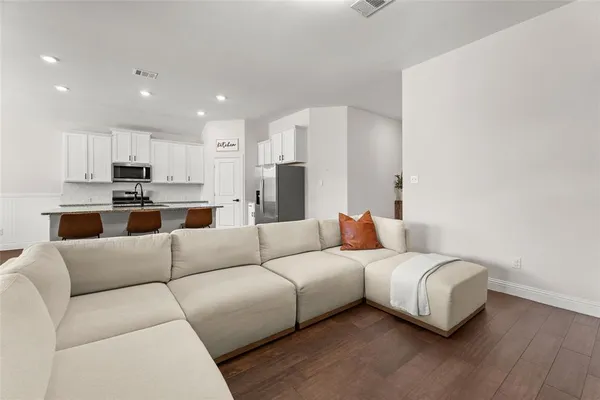 a living room with furniture and a couch