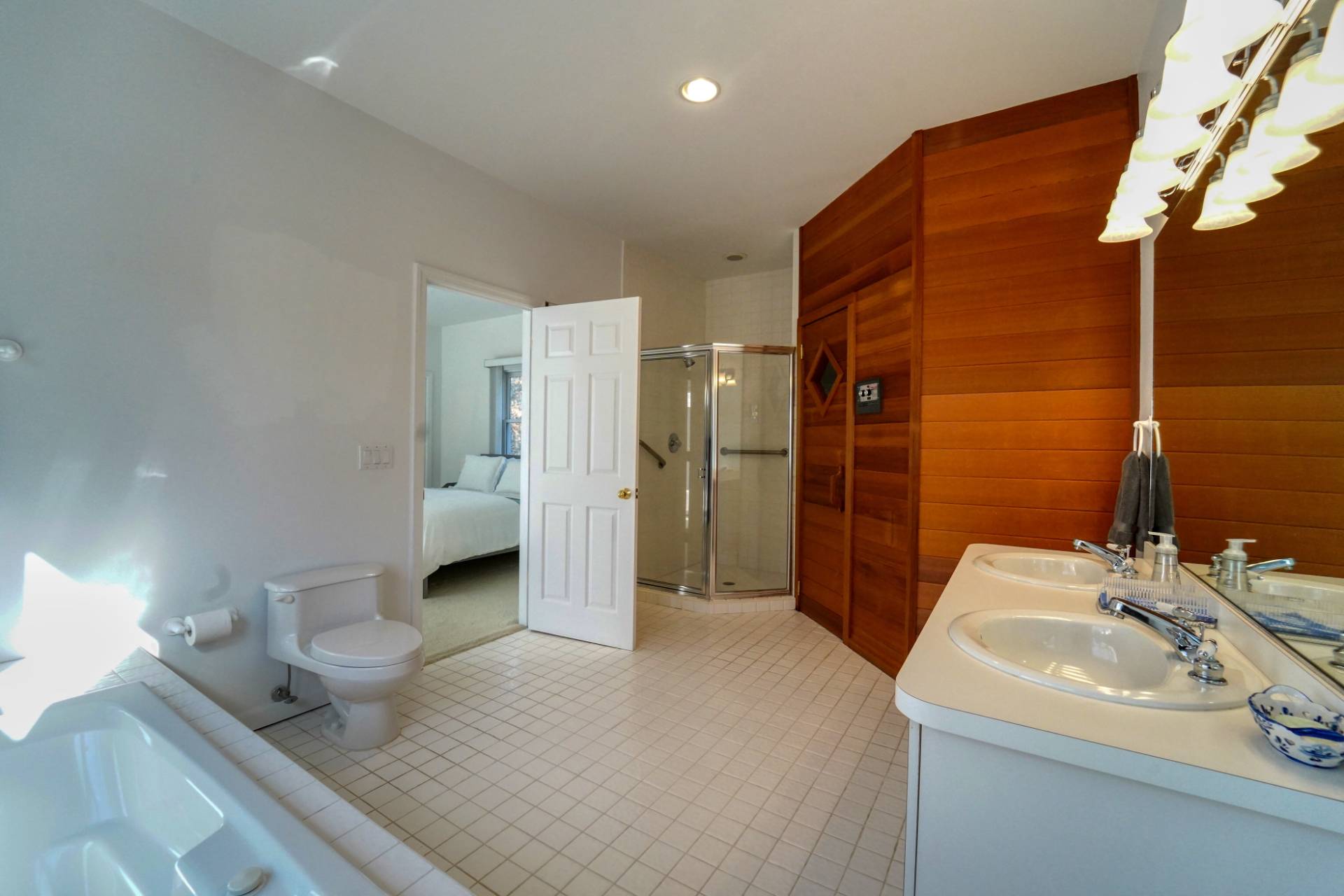 7 Plume Grass Way Westhampton, NY 11977 - Photo 12 of 23 a bathroom with a sink and a mirror